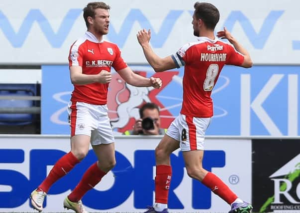 Barnsley's Sam Winnall (left) celebrates scoring their first goal at Wigan on Sunday, alongside Conor Hourihane. (Picture: Nigel French/PA)