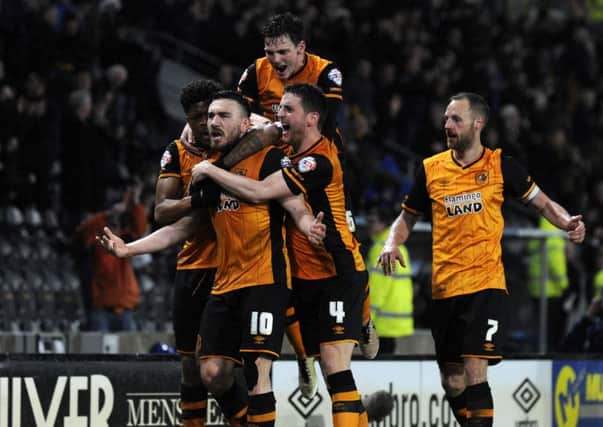 Robert Snodgrass and the Tigers celebrate.