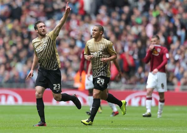 Bradford City's Rory McArdle celebrates scoring in the League Two play-off final.