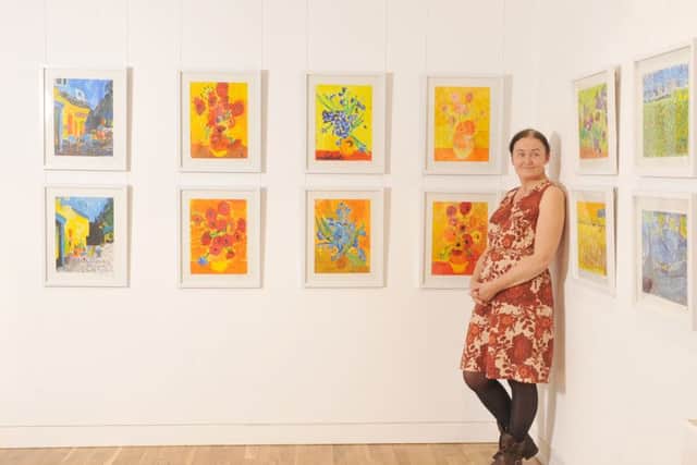 Virginija Knowles, the founder of Young Masters visual art classes with some of the children's work. Picture Tony Johnson