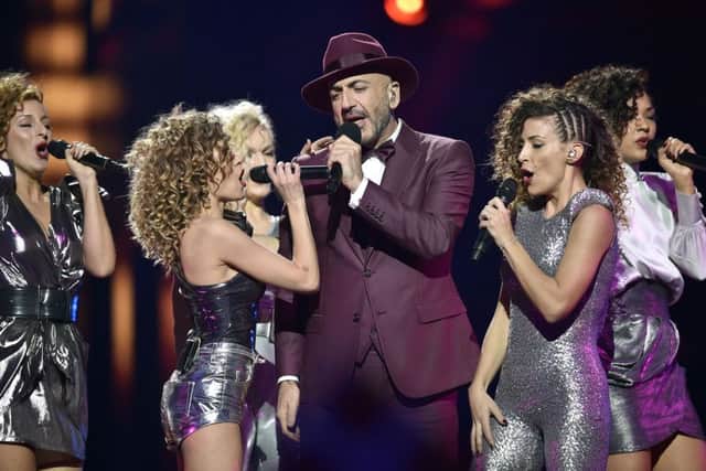 San Marino's Serhat, center, performs 'I Didn't Know'