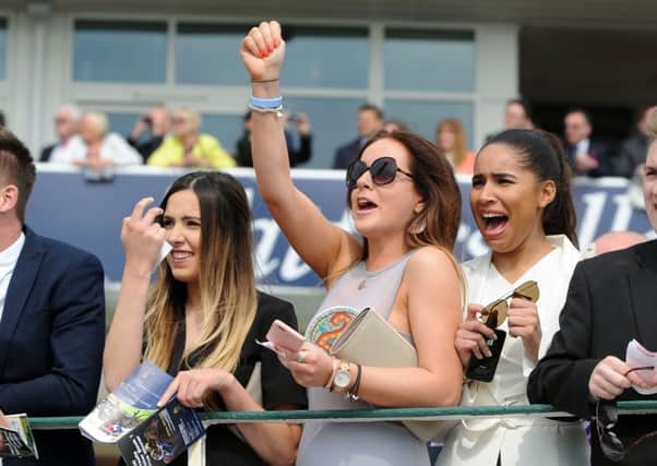 Dante Festival at York Racecourse..Day1..racegoers cheer on their horses in the 3rd Race 11th May 2016 ..Picture by Simon Hulme