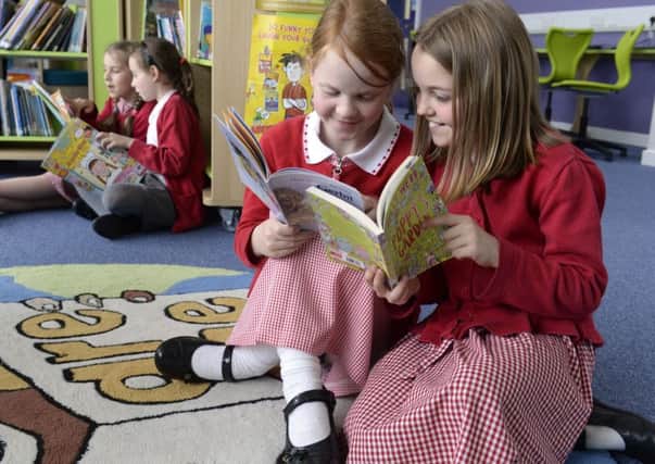 Children reading in the renovated library at Sandal Primary School, in Baildon. (Picture Bruce Rollinson).