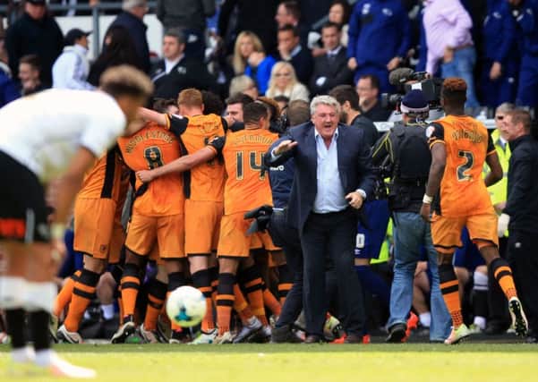 Hull City manager Steve Bruce and his players celebrate after Hull City's Andrew Robertson (not pictured) scores his side's third goal of the game during the Sky Bet Championship playoff, first leg match at the iPro Stadium, Derby.