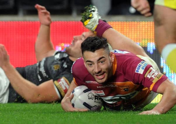 Jake Connor crossed for a try in France as Huddersfield came close to claiming victory.