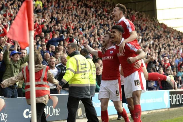 Barnsley's Sam Winnall celebrates his first goal against Walsall with Josh Fletcher and Josh Brownhill (Picture: Bruce Rollinson).