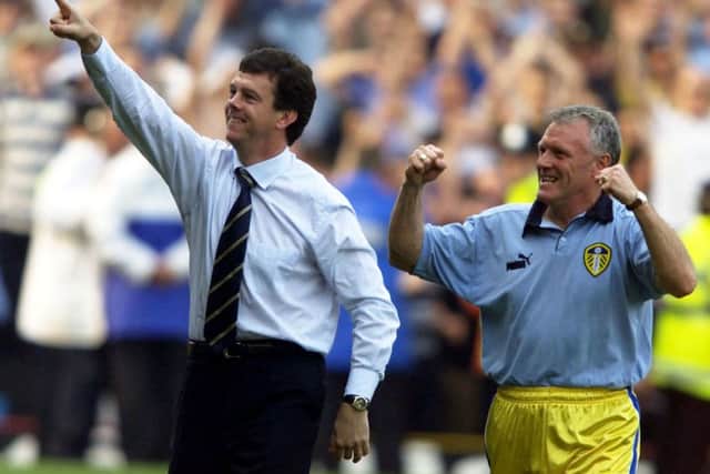 Leed United manager David O'Leary (left) and assistant manager Eddie Gray celebrate after Leeds take the third Champions League place after drawing 0-0 against West Ham on Sunday, May 14, 2000. (Picture: PA)