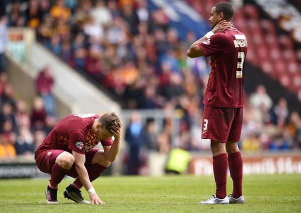 Bradford City's Lee Evans (left) and James Meredith look dejected after the Sky Bet League One play off, first leg at Valley Parade, Bradford.