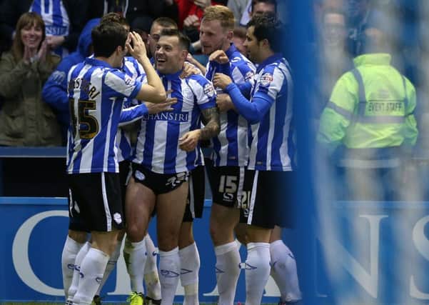 Sheffield Wednesday's Ross Wallace (centre) celebrates scoring his side's first goal of the game with teammates during the Sky Bet Championship playoff, semi-final, first leg match at Hillsborough, Sheffield.