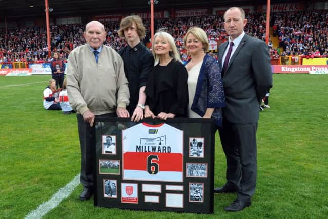Hull KR President Colin Hutton presents a club shirt to Roger Millward's wife Caro, who is alongside grandson Charlie Carter daughter Kay and son-in-law John Carter.