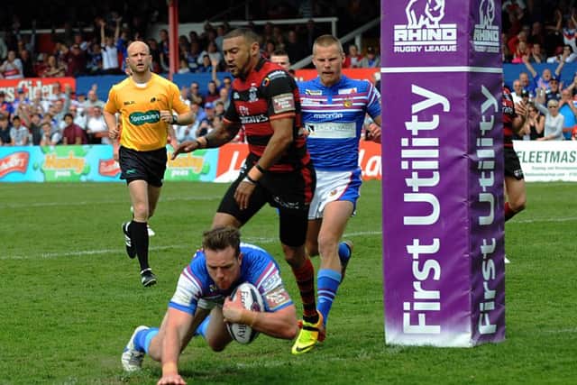 Wakefield's Matth Ashurst goes over the line against Warrington. Pictures: Dave Williams.