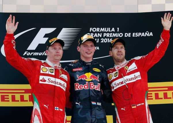 HAPPY BUNCH: Red Bull's Max Verstappen with Ferrari drivers Kimi Raikkonen, left, and Sebastian Vettel after winning the Spanish Formula One Grand Prix Picture: AP.