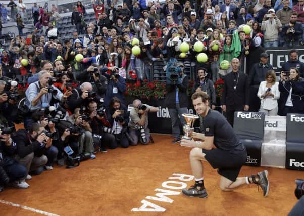 Andy Murray poses with the trophy after beating Novak Djokovic 6-3, 6-3 in the final of the Italian Open. Picture: AP.