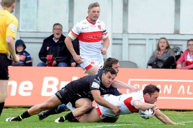Shaun Lunt goes over for a try for Hull KR against Widnes. Pictures: Steve Riding.
