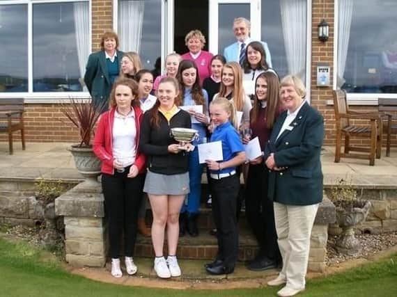YLCGA captain Dawn Clegg with champion Megan Clarke (Cleckheaton GC) and the other prize winners in the Yorkshire girls' championship at Otley GC.