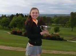 Megan Clarke (Cleckheaton GC) with the trophy after retaining her Yorkshire girls' title, at Otley GC.
