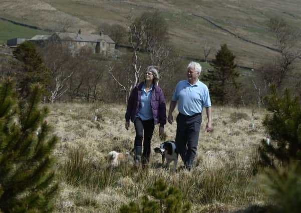 Chris and Fiona Clark with Pip and Meg at Nethergill Farm, Oughtershaw, Buckden.  Picture Bruce Rollinson