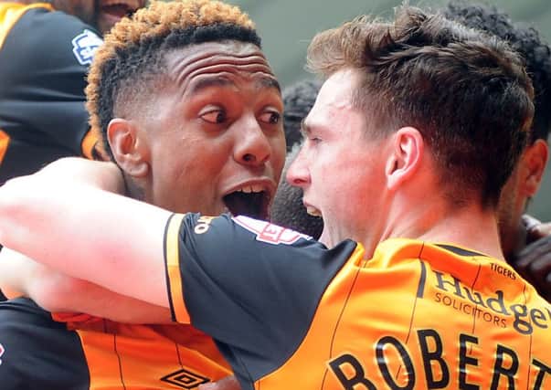 Abel Hernandez celebrates scoring Hull's first goal at Derby with Andy Robertson. (Picture: Tony Johnson)