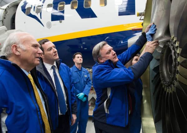Chancellor of the Exchequer George Osborne (second left) is joined by former adversaries Ed Balls (right) and Sir Vince Cable (left) as they view maintenance work, in the Ryanair hangar at Stansted Airport, where the Chancellor said that 450 jobs and almost Â£1 billion in investment announced by Ryanair would be "at risk if we left the EU". PRESS ASSOCIATION Photo. Picture date: Monday May 16, 2016. The Chancellor has accused the Leave camp in the EU referendum of indulging in conspiracy theories as he insisted there was an "overwhelming consensus" among economists and world leaders that Brexit would be bad for the UK. Mr Osborne was speaking as more than 300 business leaders signed a letter urging Britain to vote to leave the EU in the June 23 referendum, arguing that the UK's competitiveness is being undermined by its membership.