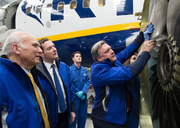 Chancellor of the Exchequer George Osborne (second left) is joined by former adversaries Ed Balls (right) and Sir Vince Cable (left) as they view maintenance work, in the Ryanair hangar at Stansted Airport, where the Chancellor said that 450 jobs and almost Â£1 billion in investment announced by Ryanair would be "at risk if we left the EU". PRESS ASSOCIATION Photo. Picture date: Monday May 16, 2016. The Chancellor has accused the Leave camp in the EU referendum of indulging in conspiracy theories as he insisted there was an "overwhelming consensus" among economists and world leaders that Brexit would be bad for the UK.
