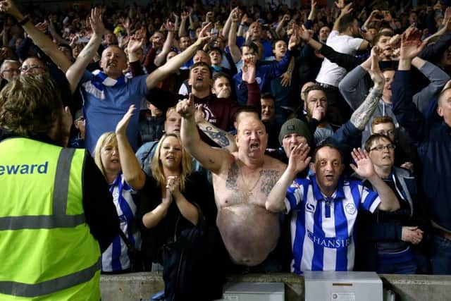 Sheffield Wednesday's fans celebrate in the stands after the final whistle.