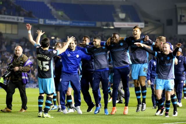 Sheffield Wednesday celebrate after the final whistle at the AMEX Stadium. Picture: Gareth Fuller/PA.