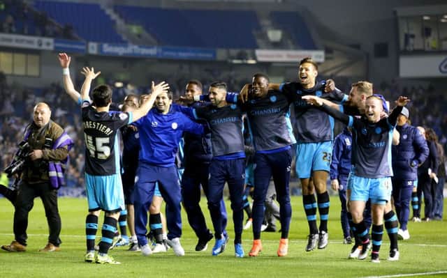 Sheffield Wednesday celebrate after the final whistle at the AMEX Stadium. Picture: Gareth Fuller/PA.