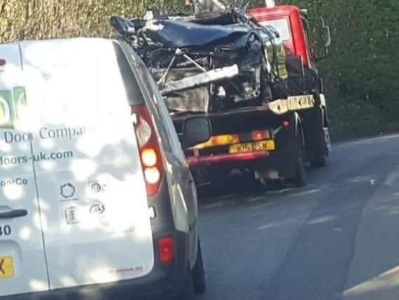 The wreckage of the BMW involved in a fatal crash on the Snake Pass