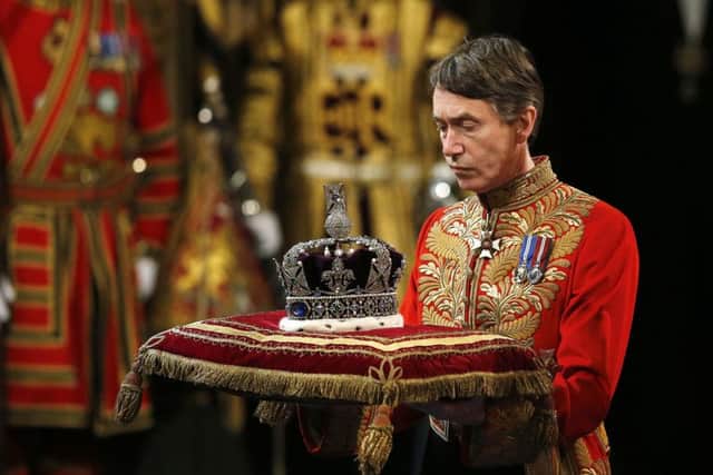 The Imperial State Crown arrives before the State Opening of Parliament, in the House of Lords at the Palace of Westminster in London. PRESS ASSOCIATION Photo. Picture date: Wednesday May 27, 2015. See PA story POLITICS Speech. Photo credit should read: Suzanne Plunkett/PA Wire