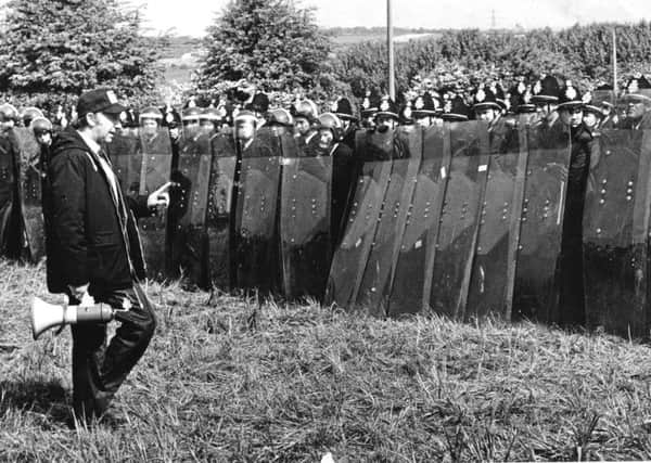 Arthur Scargill, leader of the National Union of Miners, faces a line of policemen at the Battle of Orgreave, 1984