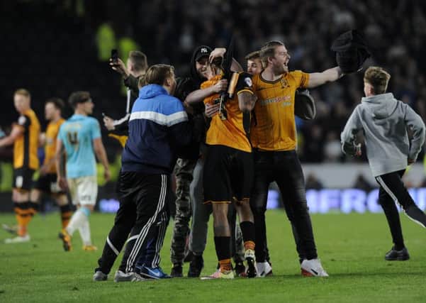 Hull fans mob Abel Hernandez at the final whistle at the KC Stadium.  Picture Bruce Rollinson