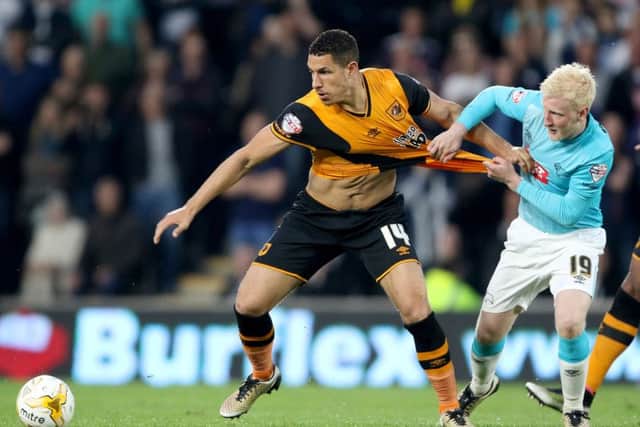 Hull City's Jake Livermore (left) and Derby County's Will Hughes battle for the ball. Picture: PA.