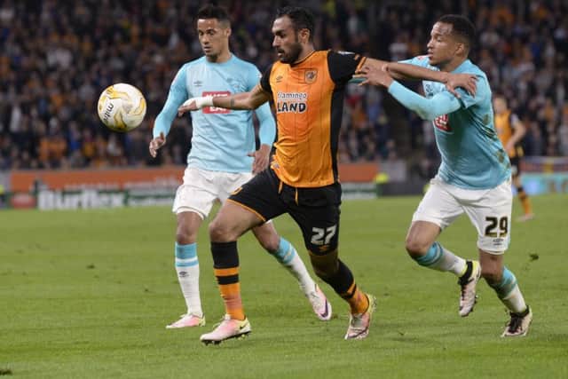 Ahmed Elmohamady moves away from Marcus Olsson.  Picture: Bruce Rollinson