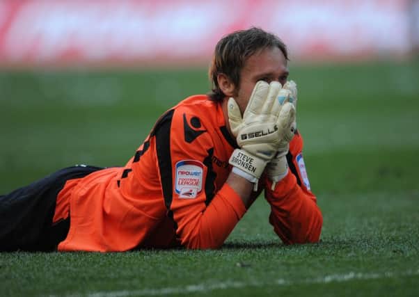 Sheffield United goalkeeper Steve Simonsen is distraught after missing the final penalty in the 2012 League One play-off final.
