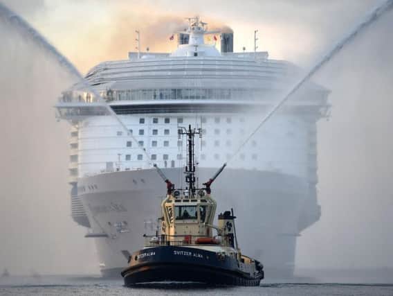 The world's largest passenger ship, MS Harmony of the Seas, owned by Royal Caribbean, makes her way up Southampton Water into Southampton ahead of her maiden cruise. Image: Andrew Matthews/PA Wire