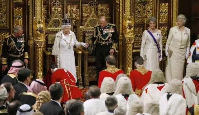 Queen Elizabeth II and the Duke of Edinburgh leave the House of Lords following her speech during the State Opening of Parliament at the Palace of Westminster in London. Alastair Grant/PA Wire