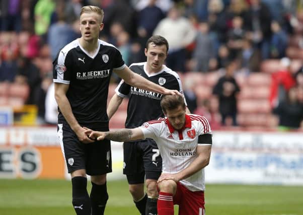 Marc Roberts of Barnsley consoles Billy Sharp of Sheffield United, earlier this season. (Picture: Sport Image)
