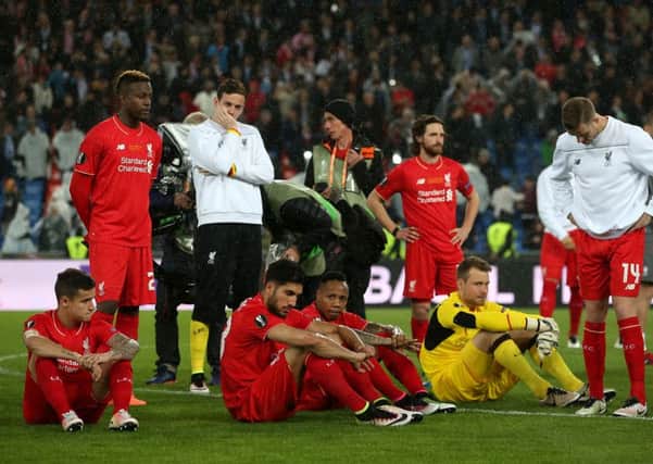 Liverpool players look dejected. Picture: David Davies/PA
