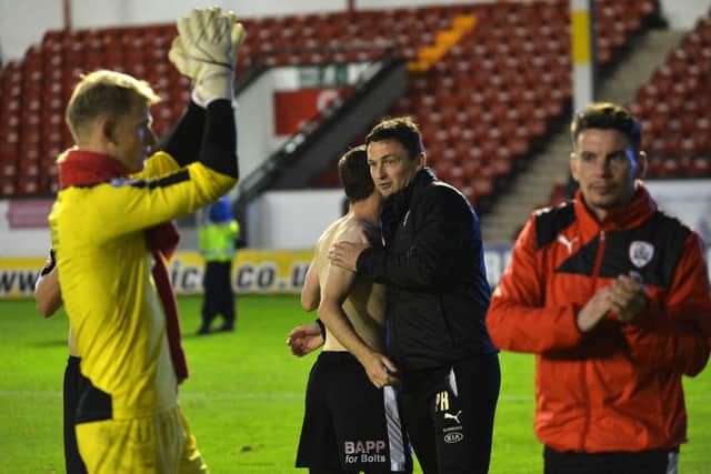 Barnsley's manager Paul Heckingbottom congratulates his players.
 Picture : Jonathan Gawthorpe