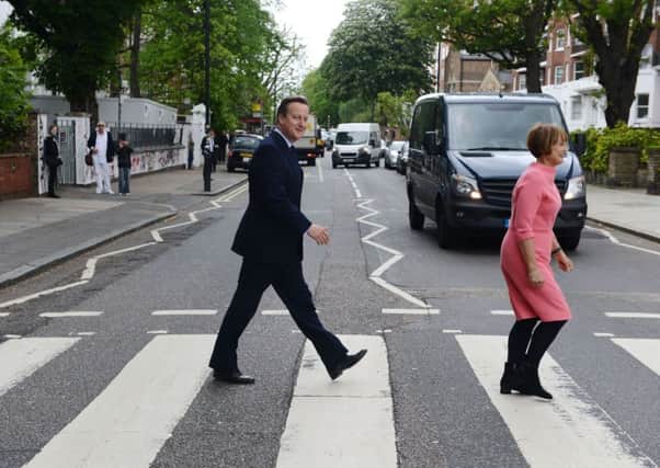 Prime Minister David Cameron with Labour's former culture secretary Tessa Jowell at Abbey Road.