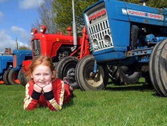 Youngster Charlotte Wilson looks ahead to Newby Hall's vintage tractor event.