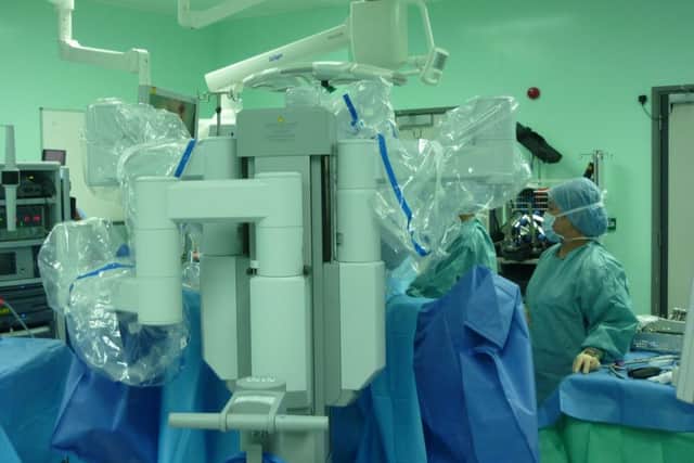 A Da Vinci surgical robot in use.