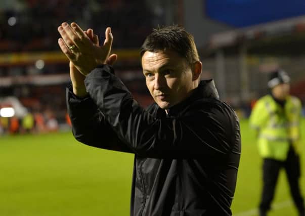 Paul Heckingbottom applauds the fans after Barnsleys win at Walsall on Thursday took them to Wembley (Picture: Jonathan Gawthorpe).