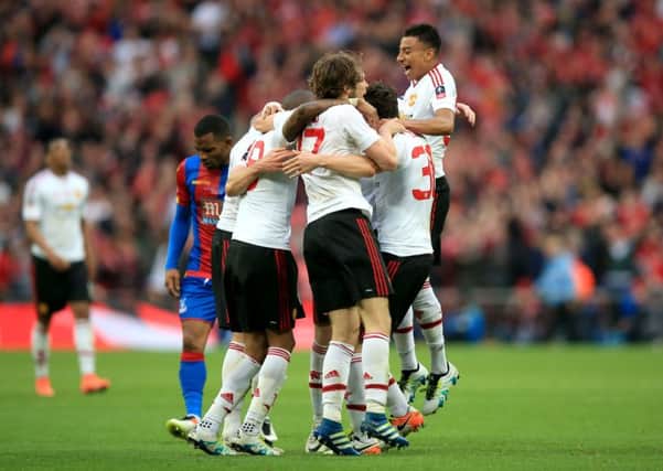 Manchester United players celebrate winning the FA Cup Final at Wembley. Picture: Mike Egerton/PA