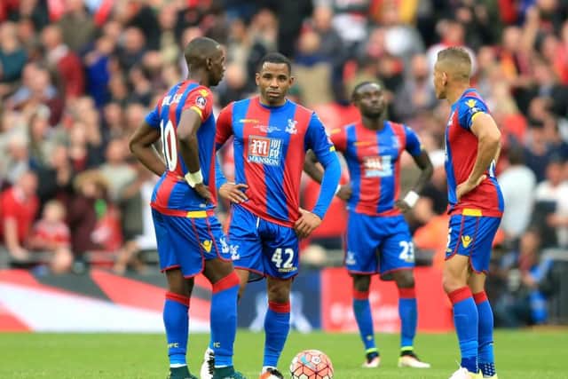 Crystal Palace's Yannick Bolasie, Jason Puncheon and Dwight Gayle dejected at the restart after Manchester United score their second goal  at Wembley.