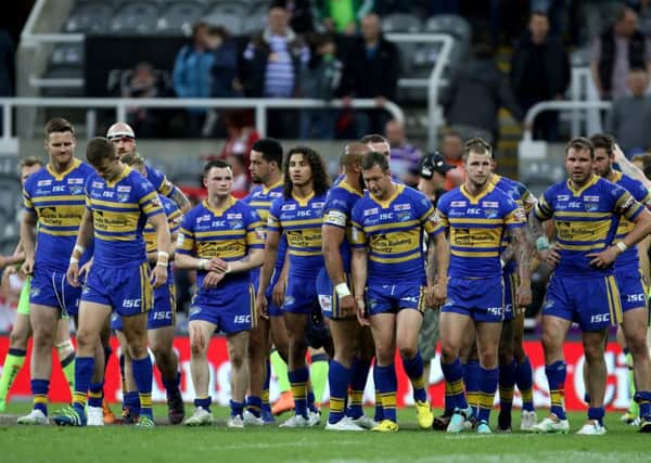 Leeds Rhinos' players stand dejected after defeat to Wigan at St James's Park. Picture: Richard Sellers/PA