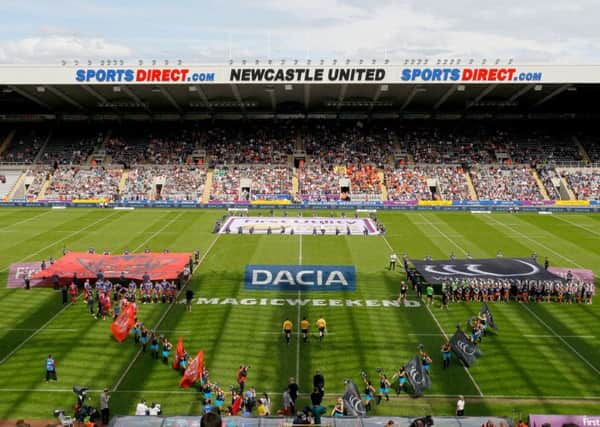 OPENING UP: Salford Reds and Widnes Vikings walk on to the pitch at the start of the 2016 Magic Weekend at St James's Park. Picture: Richard Sellers/PA