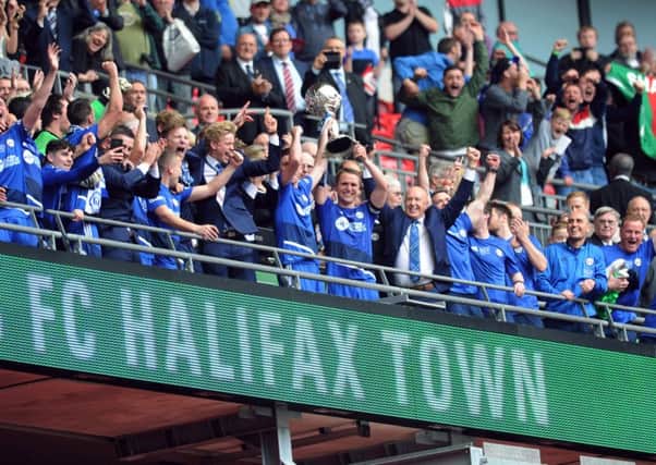 FC Halifax Town celebrate with the FA Trophy after victory over Grimsby Town (Picture : Jonathan Gawthorpe).