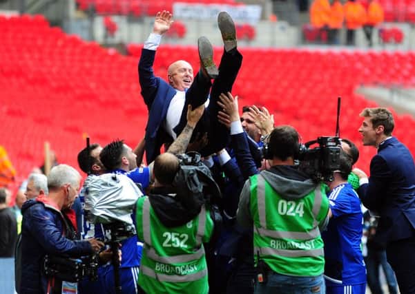 FC Halifax Town manager Jim Harvey is hoisted aloft by his players at Wembley (Picture: Jonathan Gawthorpe).
