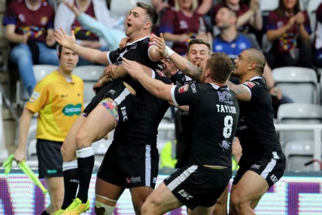 Hull FC's Curtis Naughton celebrates with his team-mates after scoring against city rivals Hull KR at St James's Park. Picture: Richard Sellers/PA